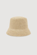 A light beige woven straw bucket hat, shown from the back against a solid light gray background.