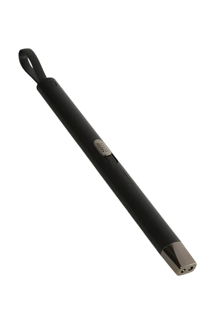 Black cylindrical object on a white background