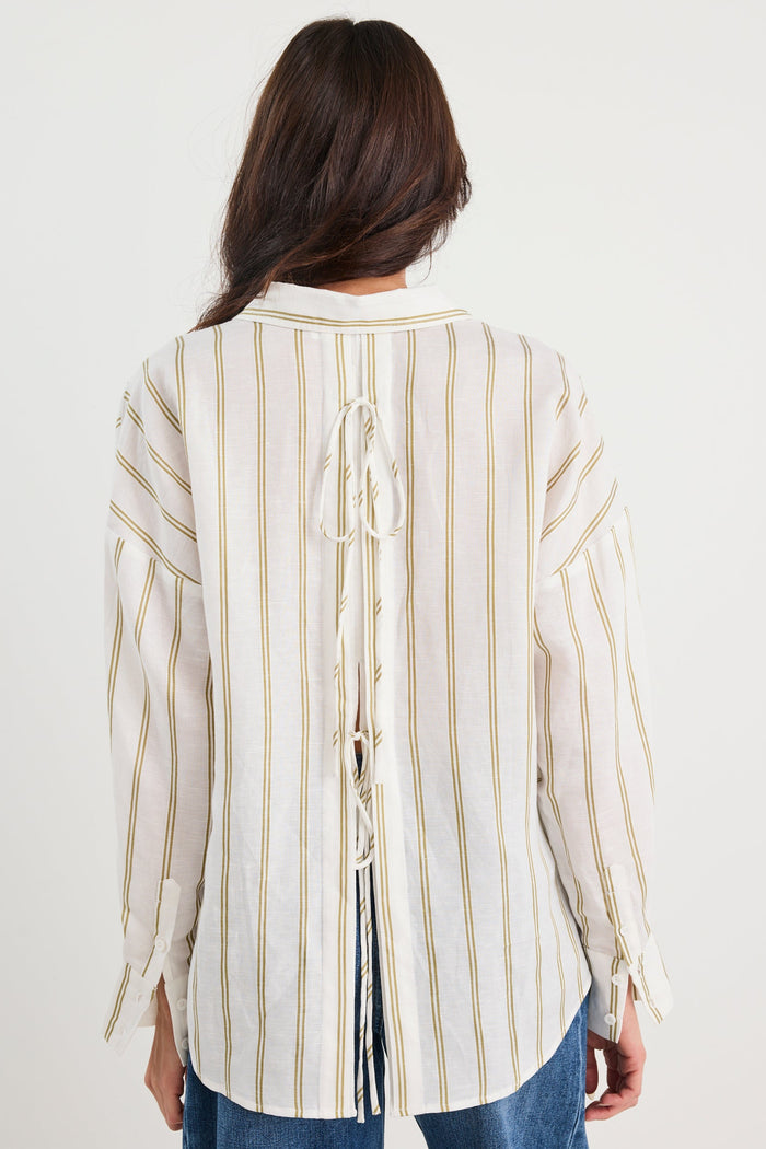 Woman wearing a striped shirt with a white background
