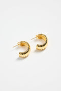 gold-plated brass huggie earrings with a ridged design, photographed flat on a white background.