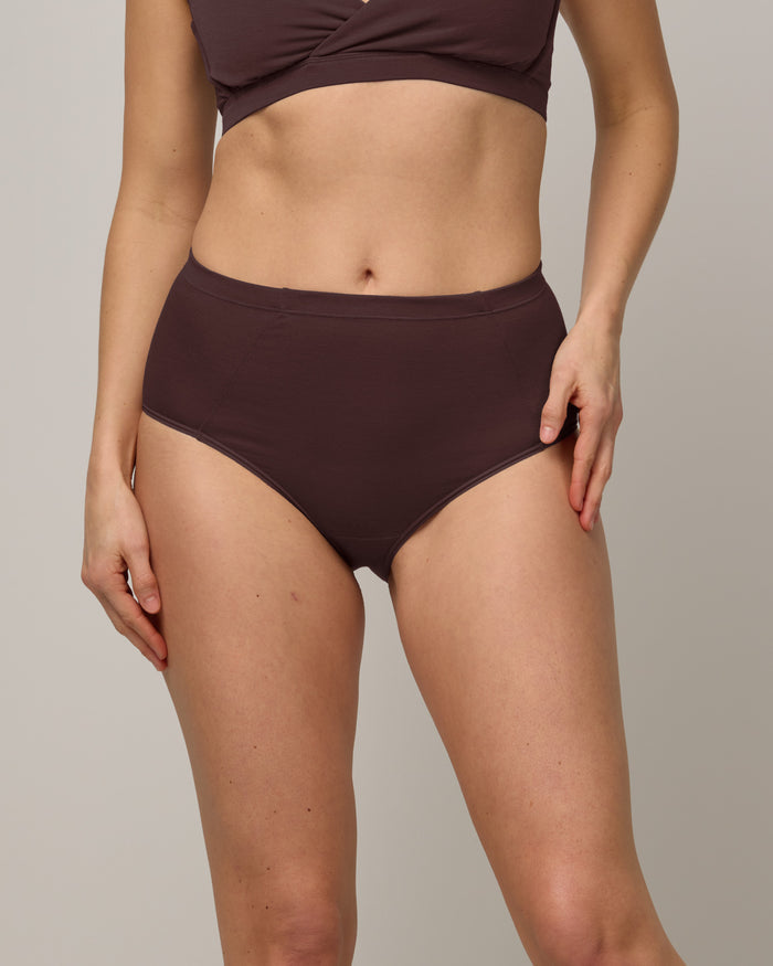 Model wearing Roam High Waist Bikini in Espresso, a dark brown color. Roam High Waist Bikini is a merino wool underwear available in sizes XS-3X.