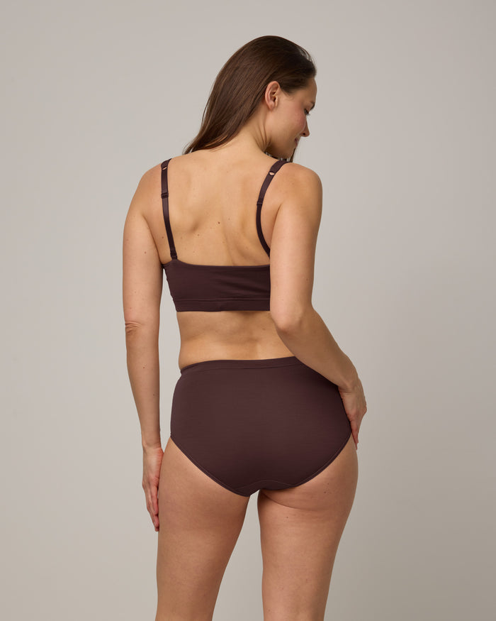 Model wearing Roam High Waist Bikini in Espresso, a dark brown color. Roam High Waist Bikini is a merino wool underwear available in sizes XS-3X.