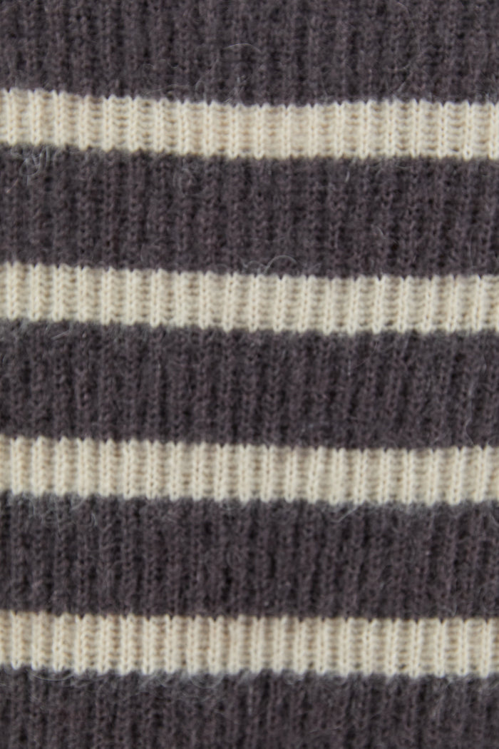 Close-up of a striped fabric with dark and light horizontal bands.