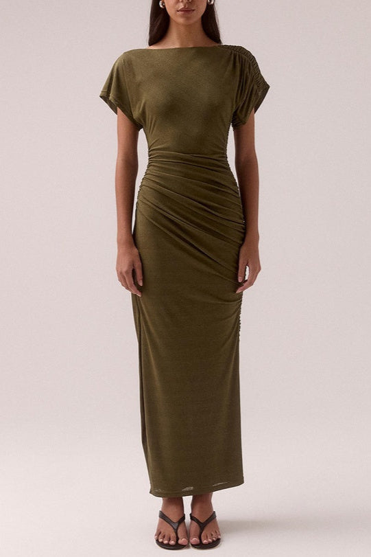 model wears a olive green ruched dress