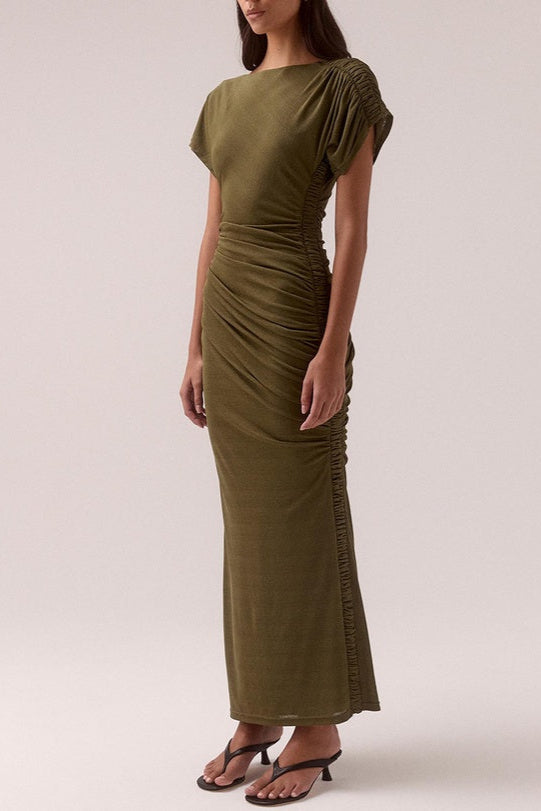 model wears a olive green ruched dress