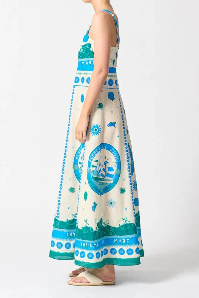 Woman wears a colourful blue strappy maxi dress
col_pattern