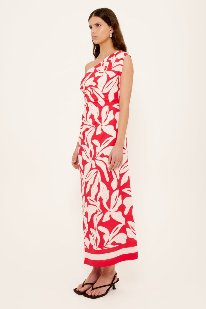 Woman wears a red white floral asymmetric dress
