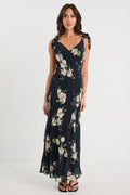 Woman wearing a floral dress on a white background