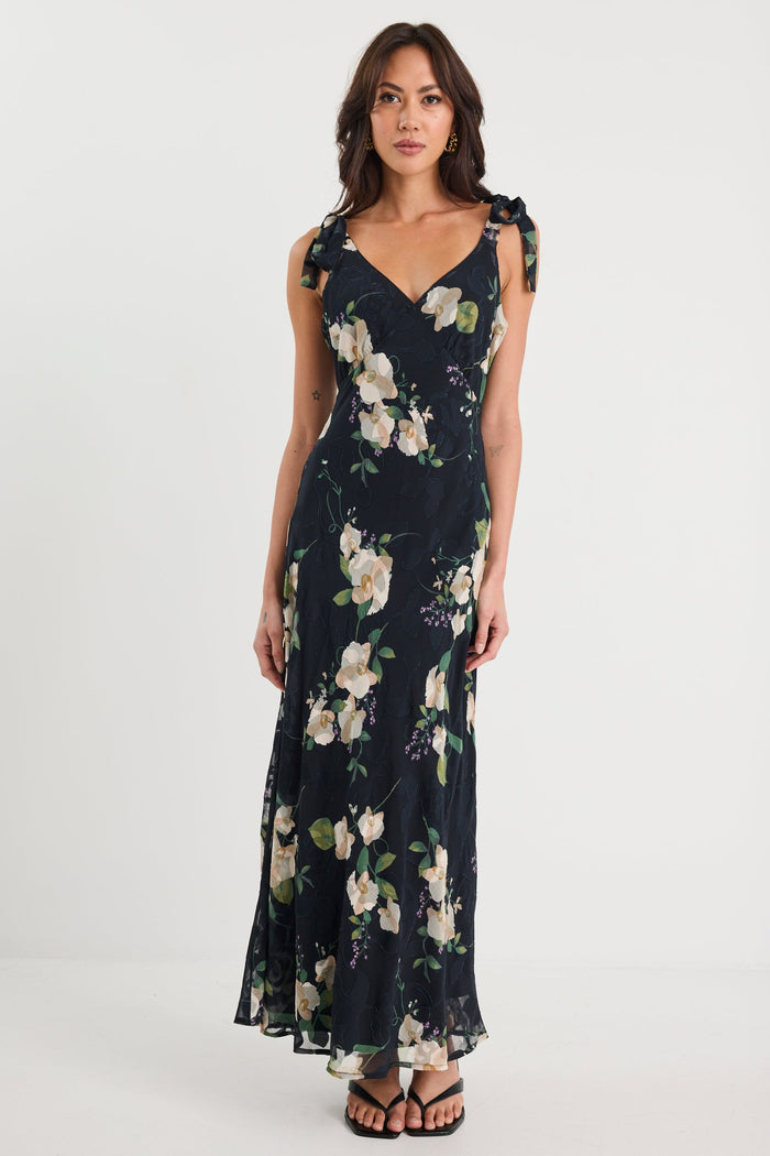 Woman wearing a floral dress on a white background