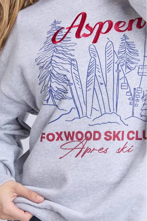 Gray sweatshirt with 'Aspen Foxwood Ski Club' design on a plain background