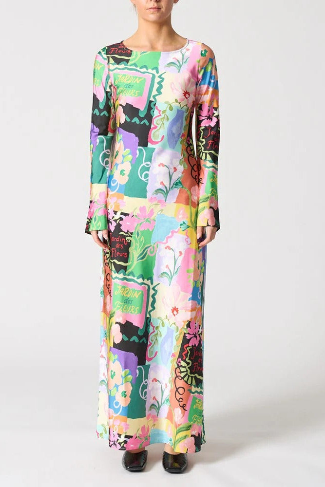Woman wearing a colorful floral dress on a white background