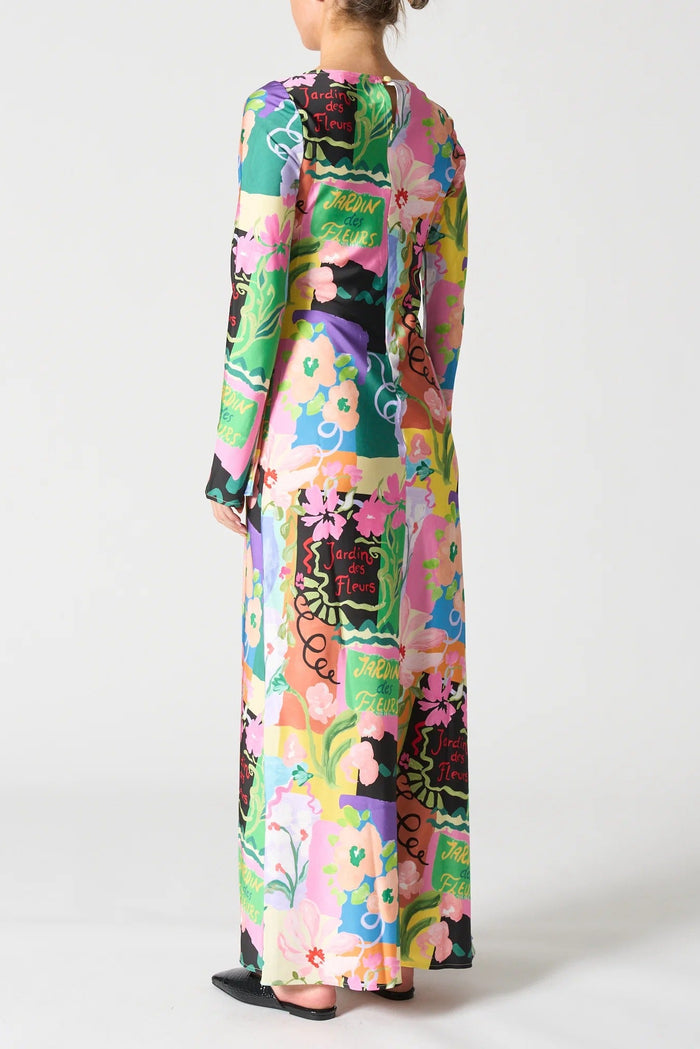 Multicolored floral dress worn by a person on a white background