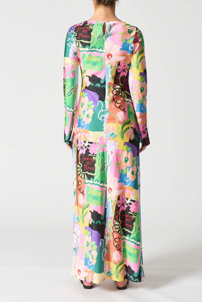 Multicolored floral dress with long sleeves on a white background
