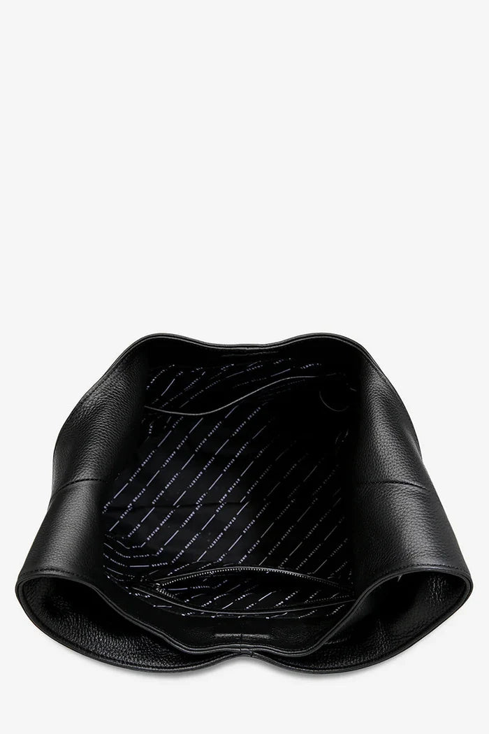Black car mat with textured surface on a white background