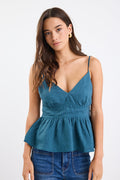 A forest green strappy cami top made from 100% linen, with a V-neckline and tie-back detail. Fully lined for comfort and breathability.