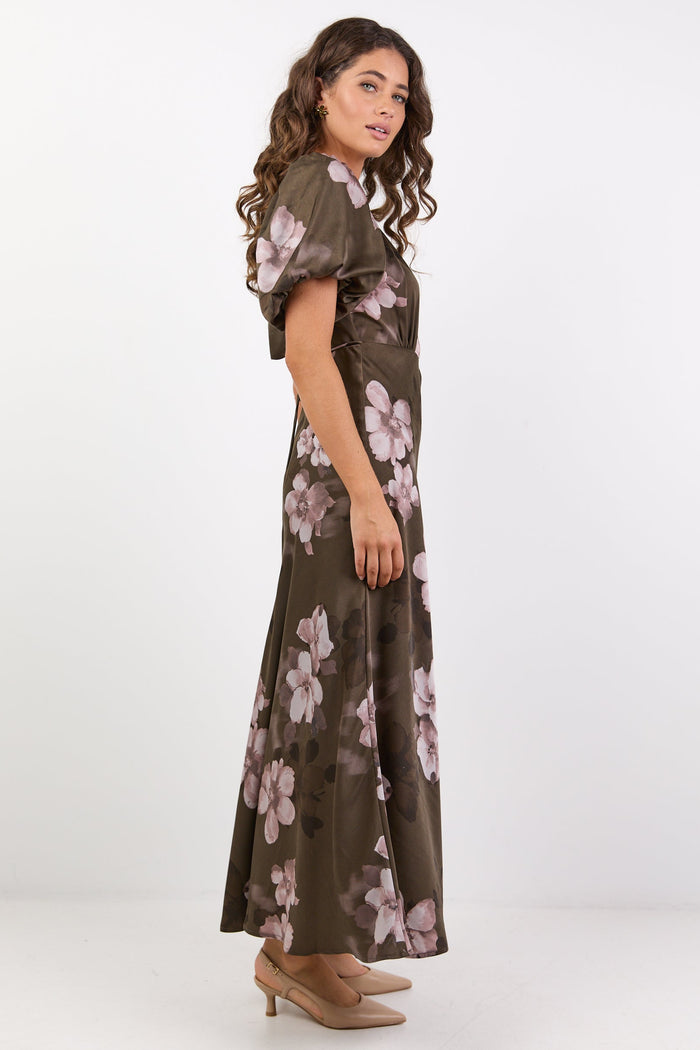 Woman wearing a floral dress on a white background