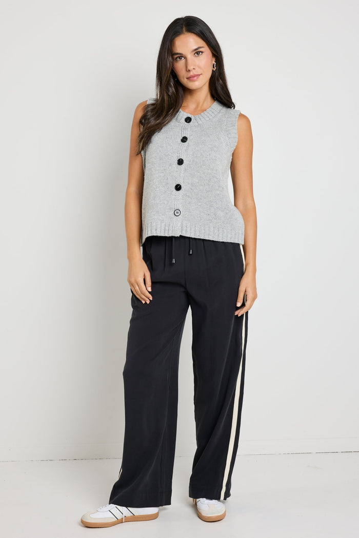 model wears grey knit vest top
