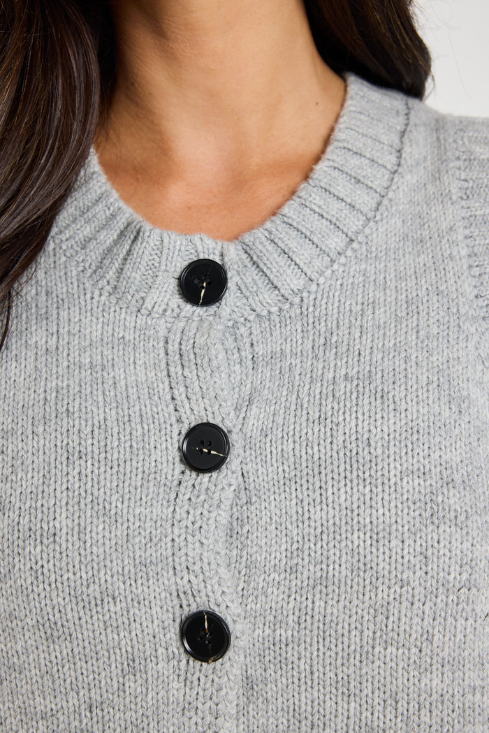 model wears grey knit vest top