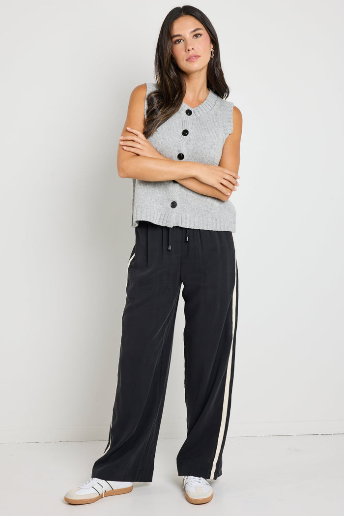 model wears grey knit vest top