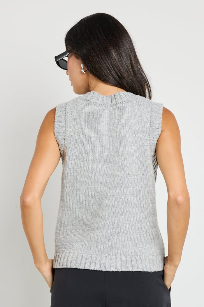 model wears grey knit vest top