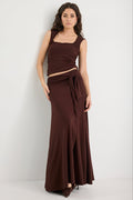 Woman wearing a brown ruched set