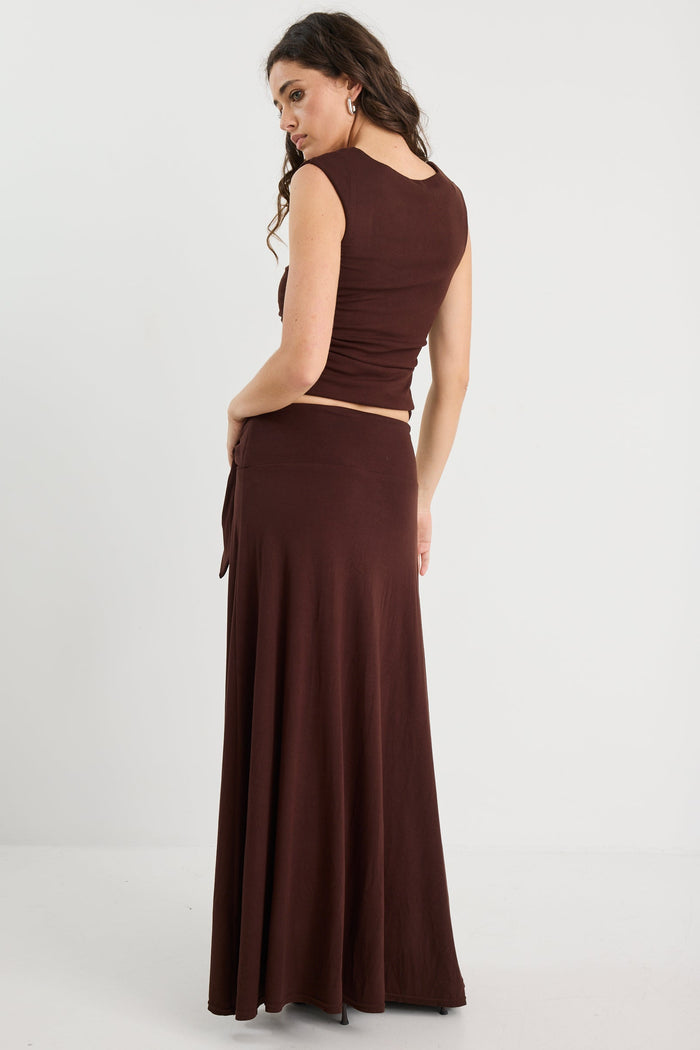 Woman wearing a brown ruched set