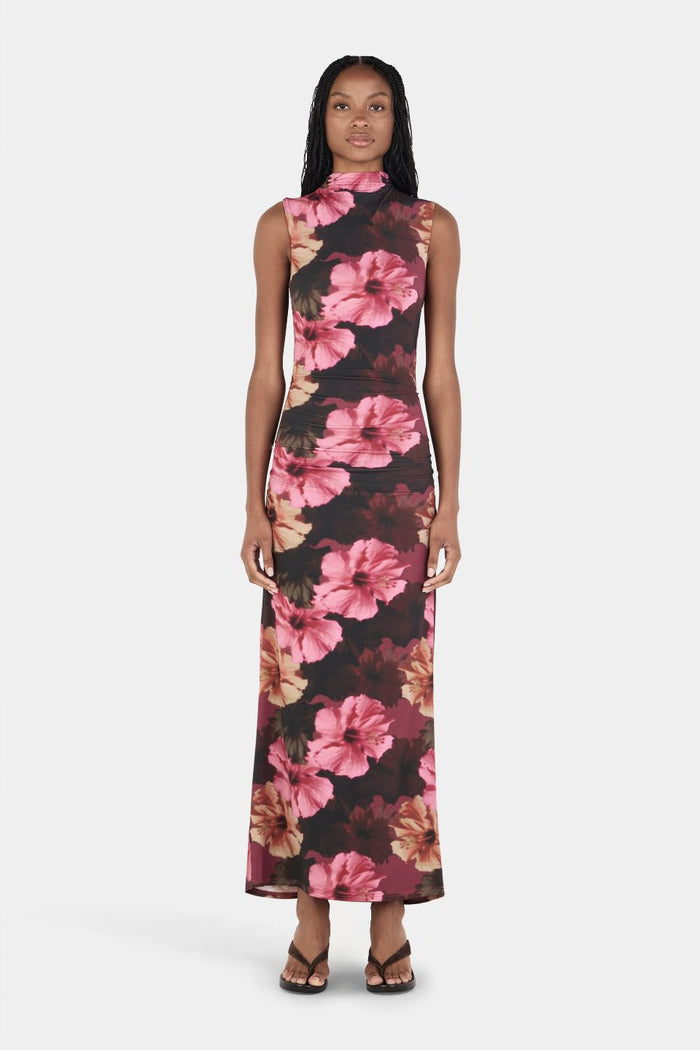 Woman wearing a floral dress on a white background