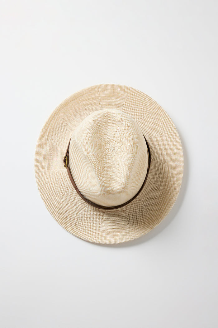 Taupe woven Panama-style hat with a brown band and gold buckle detail, photographed on a white background