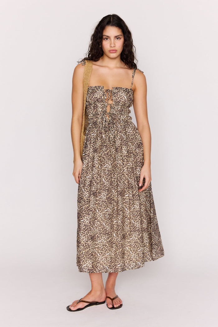 Woman wearing a floral dress on a white background