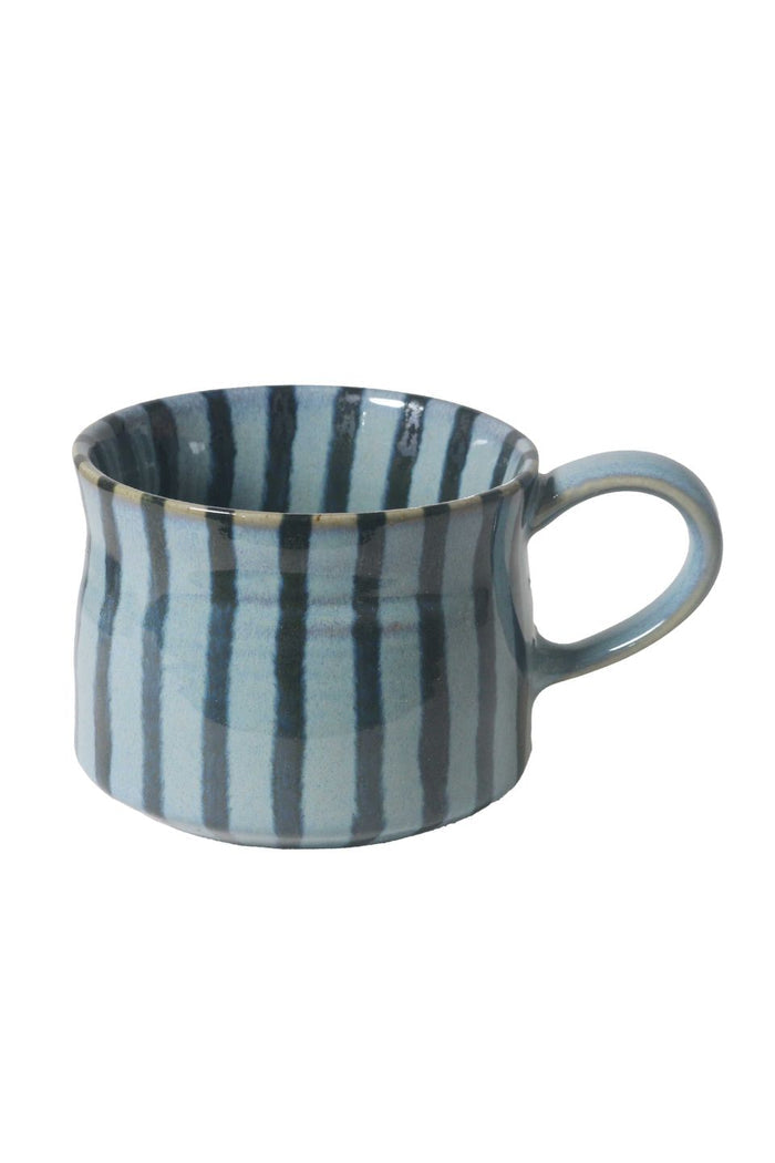 Striped ceramic mug on a white background