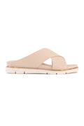 A single light beige leather slide sandal with crisscrossing straps and a low chunky sole, shown in profile against a plain white background.