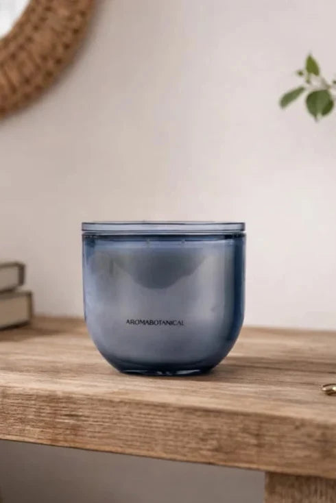 Blue glass container on a wooden surface with a blurred background