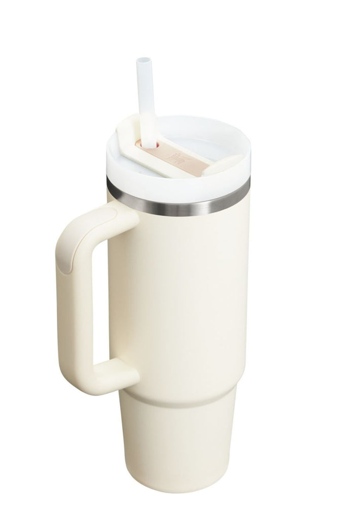White insulated mug with handle and straw on a white background