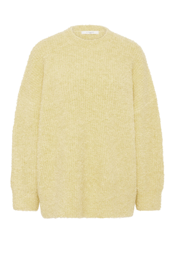 Yellow textured sweater on a white background