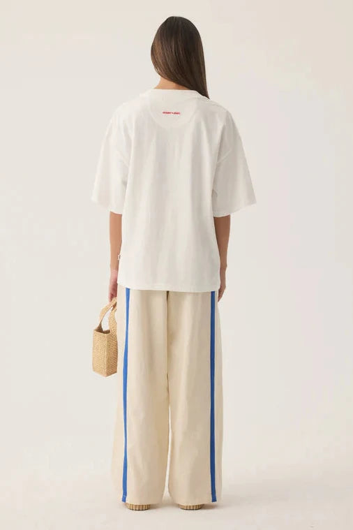Woman wearing Tropiques Oversized Tee Warm White