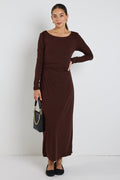 model wears a black long sleeve maxi dress