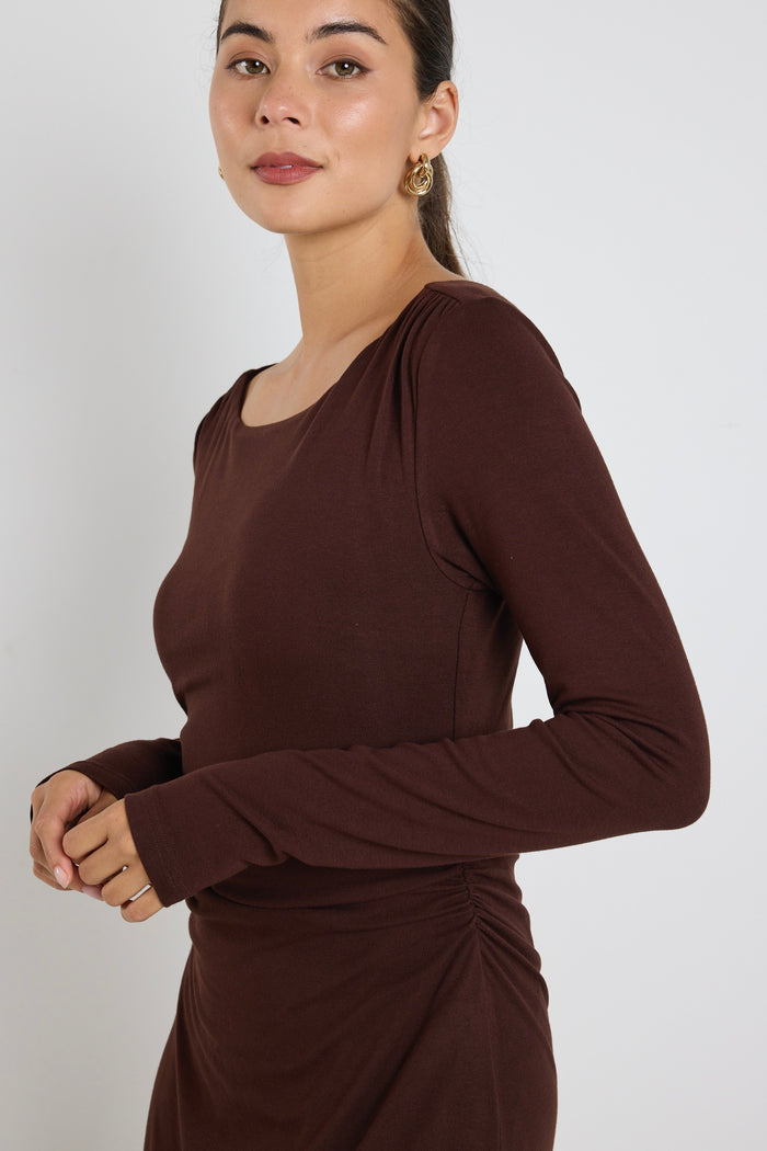 model wears a black long sleeve maxi dress
