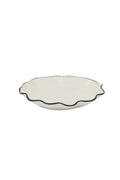 ceramic wavy plate with black trim