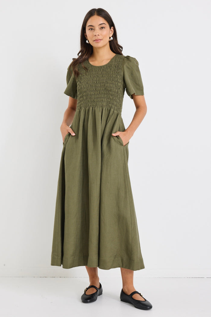 model wears a khaki linen midi dress