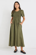 model wears a khaki linen midi dress