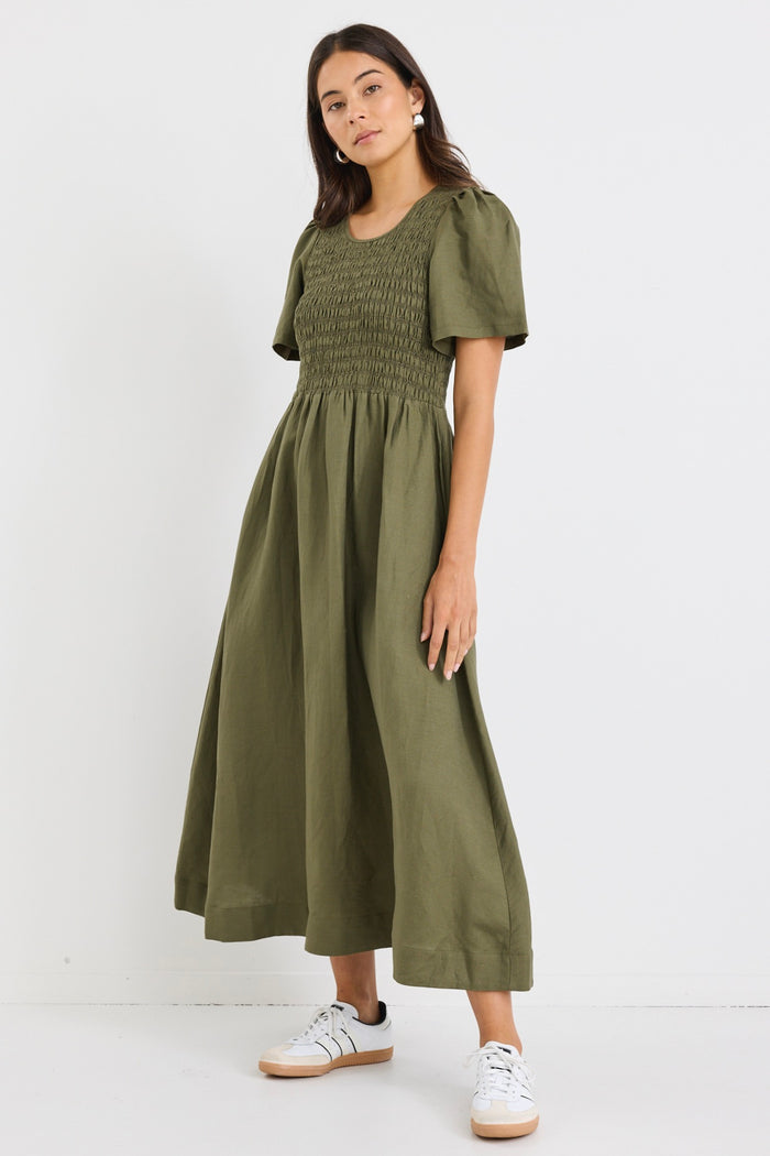 model wears a khaki linen midi dress