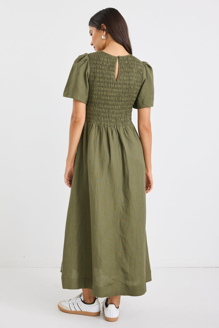 model wears a khaki linen midi dress