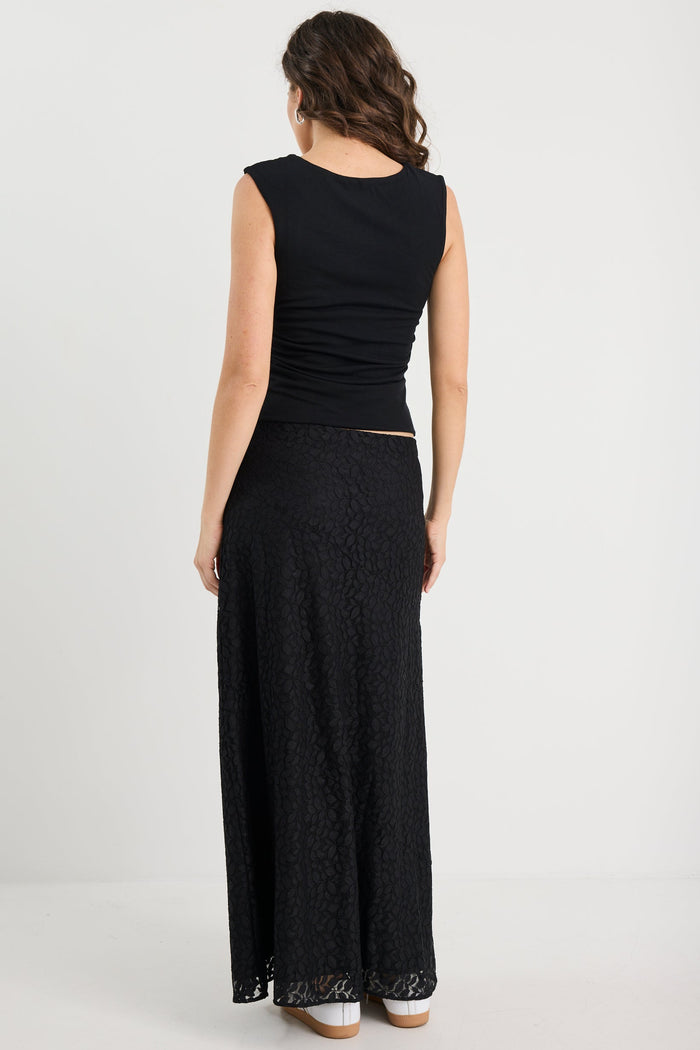 Woman wearing a black dress on a white background
